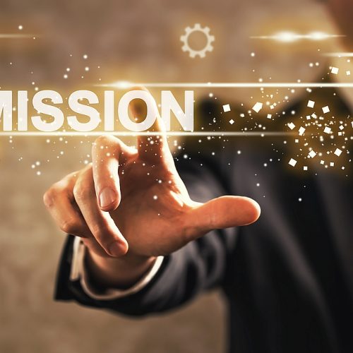 Mission text with businessman Mission text with businessman on dark vintage background